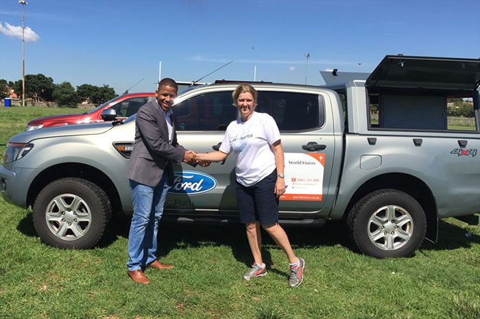 Ensly Dooms from Ford South Africa and Paula Barnard from World Vision SA at the official handover of the Ford Rangers in Soweto, Johannesburg.
